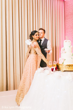 Lovely capture Indian groom giving cake to the bride. Lovely capture Indian groom giving cake to the bride.