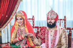Indian bride and groom holding hands Indian bride and groom holding hands