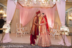 Indian couple kissing under the decor Indian couple kissing under the decor