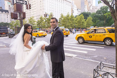 Indian newlyweds outdoors during pictures Indian newlyweds outdoors during pictures