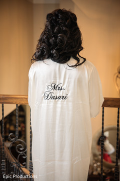 Lovely indian bride on her personalized robe to get ready. Lovely indian bride on her personalized robe to get ready.