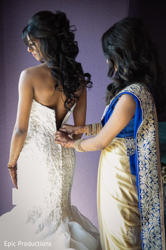Sweet indian bride getting help to get ready. Sweet indian bride getting help to get ready.