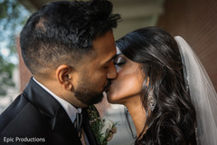 Lovely Indian groom kissing bride photo session. Lovely Indian groom kissing bride photo session.