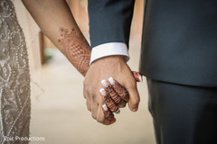 Indian bride and groom holding hands close up capture. Indian bride and groom holding hands close up capture.