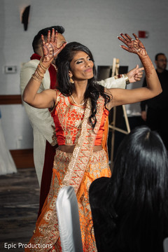 Indian newlyweds making their entrance to wedding reception Indian newlyweds making their entrance to wedding reception