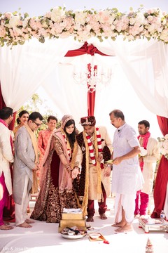 Rajaham bride and groom throw the rice onto sacred fire. Rajaham bride and groom throw the rice onto sacred fire.