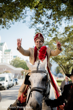 Elegant Indian groom riding his baraat horse. Elegant Indian groom riding his baraat horse.