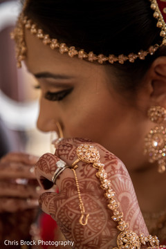 Indian bride Putin her Parvathi nose ring. Indian bride Putin her Parvathi nose ring.