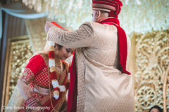 Indian groom putting garland to bride capture. Indian groom putting garland to bride capture.