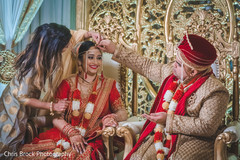Red mark applied on bride by groom. Red mark applied on bride by groom.