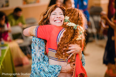 Indian bride hugging a special guest Indian bride hugging a special guest