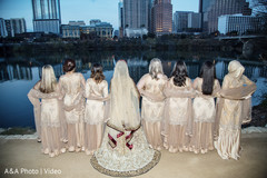 Indian bride posing with the bridesmaids by the shore Indian bride posing with the bridesmaids by the shore