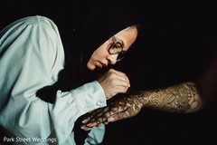 Indian Henna artist in action capture. Indian Henna artist in action capture.
