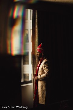 Indian groom looking out the window. Indian groom looking out the window.