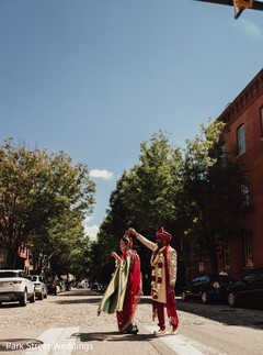 Indian bride and groom posing with their ceremony outfits. Indian bride and groom posing with their ceremony outfits.