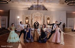 Gleeful indian wedding reception dance performance. Gleeful indian wedding reception dance performance.