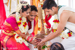 Indian bride and groom during the pre wedding rituals Indian bride and groom during the pre wedding rituals