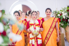 Indian bride making her entrance escorted by bridesmaids Indian bride making her entrance escorted by bridesmaids
