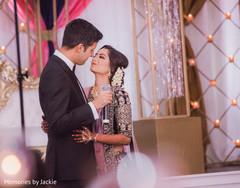 Indian groom kissing the Indian bride Indian groom kissing the Indian bride