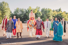 Indian groom riding the white horse for the baraat Indian groom riding the white horse for the baraat