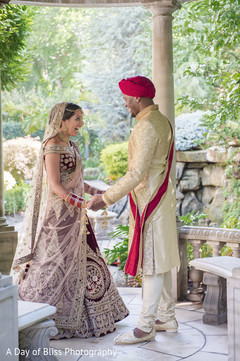 Sweet and lovely Indian bride's and groom's first look scene. Sweet and lovely Indian bride's and groom's first look scene.