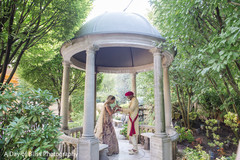 Indian bride and groom under the mandap Indian bride and groom under the mandap