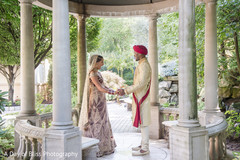Indian bride and groom holding hands Indian bride and groom holding hands