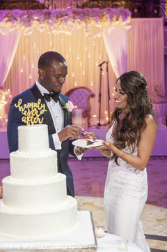Indian groom sharing a slice of cake with Maharani Indian groom sharing a slice of cake with Maharani