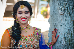 Indian bride posing for pictures outdoors Indian bride posing for pictures outdoors