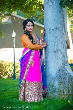 Indian bride by the three posing for pictures Indian bride by the three posing for pictures