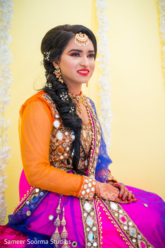 Indian bride posing for pictures before the rituals Indian bride posing for pictures before the rituals