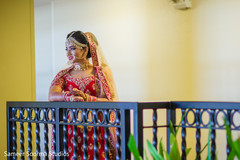 Indian bride posing for pictures at the balcony Indian bride posing for pictures at the balcony