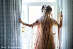 Indian bride looking through the window Indian bride looking through the window