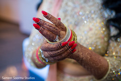 Indian bride showing her mehndi design Indian bride showing her mehndi design