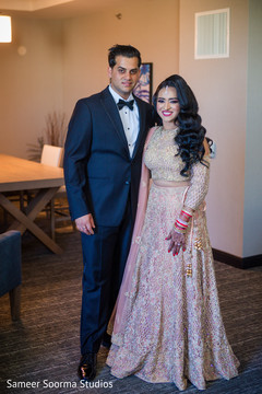 Indian bride and groom posing for pictures Indian bride and groom posing for pictures