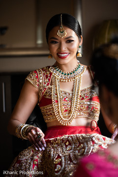 Joyful Indian bride with her open shirt lehenga. Joyful Indian bride with her open shirt lehenga.