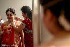 Maharani putting her Long Rani Haar. Maharani putting her Long Rani Haar.