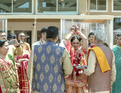 Indian bride throwing rice on her back capture. Indian bride throwing rice on her back capture.