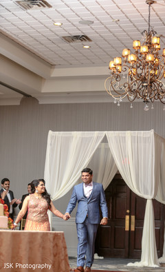 Indian bride and groom entering their reception party. Indian bride and groom entering their reception party.
