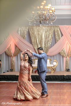 Joyful Indian bride and groom at the end of dance. Joyful Indian bride and groom at the end of dance.