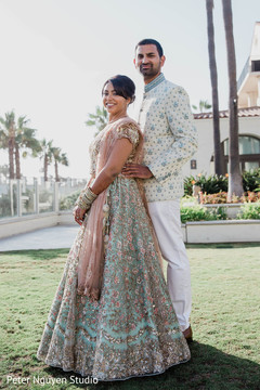 Indian couple taking pictures outside Indian couple taking pictures outside
