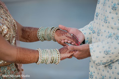 Indian bride and groom holding hands Indian bride and groom holding hands