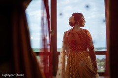Indian bride looking through the window Indian bride looking through the window