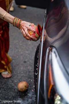 Indian wedding guest blessing the car Indian wedding guest blessing the car