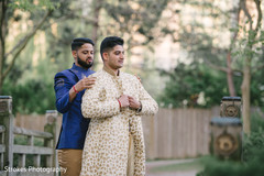 Indian groom being assisted by special guest Indian groom being assisted by special guest