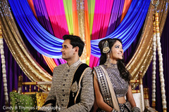 Indian bride and groom on their sangeet outfits. Indian bride and groom on their sangeet outfits.