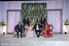 Adorable Indian couple posing with family. Adorable Indian couple posing with family.