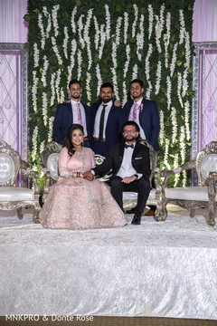 Indian bride and groom posing with groomsmen. Indian bride and groom posing with groomsmen.