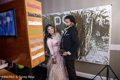 Lovely Indian couple posing at photo booth. Lovely Indian couple posing at photo booth.