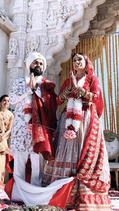 Couple during a moment of the ceremonies Couple during a moment of the ceremonies